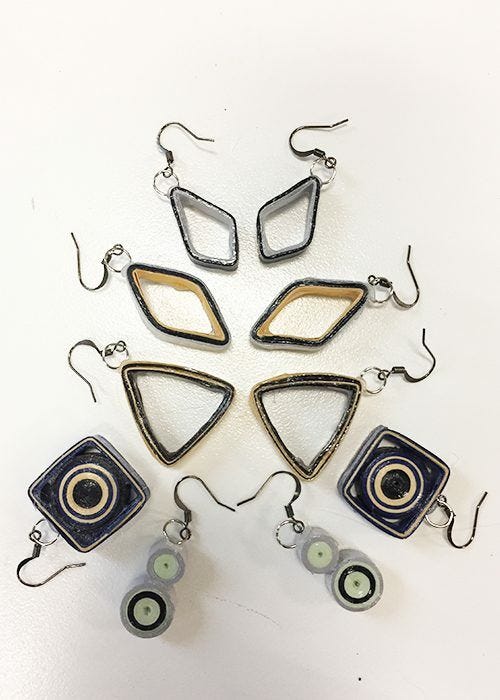 assortment of paper earrings in stacked arrangement