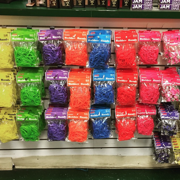 JAM colorful rubber bands packs hanging in office supply store