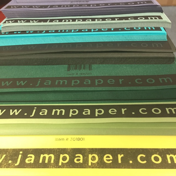 jampaper stacks of different colored paper