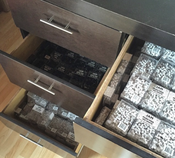 Boxes of pushpins and paperclips in drawers desk drawers, office drawers, office supplies, push pins, boxes, organization
