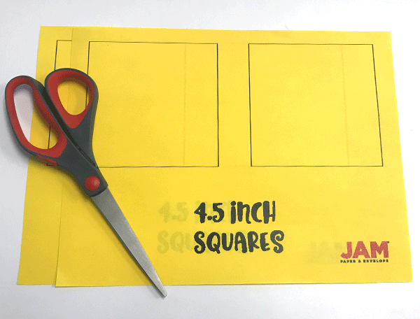 Yellow paper with 4.5 inch squares, scissors