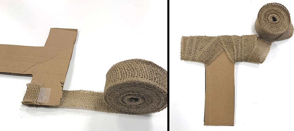 wrapping and taping cardboard letter t with roll of burlap