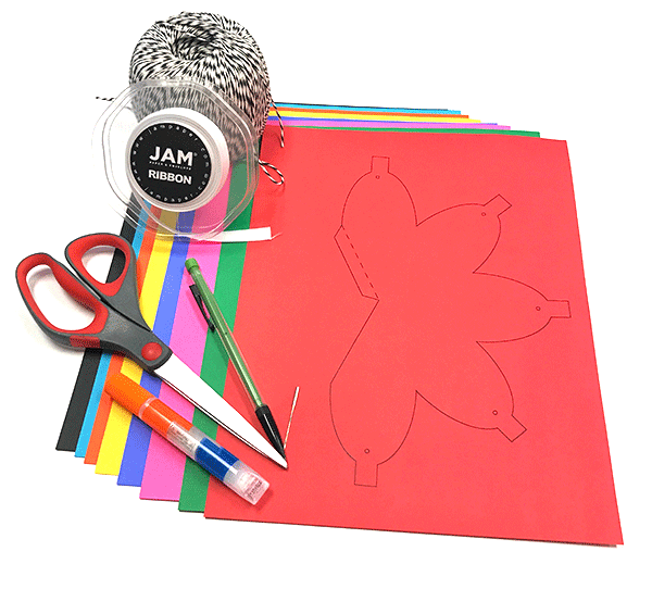 Art supplies for DIY Christmas lights - colored card stock paper, glue, twine, ribbon, pencils, scissors