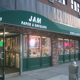 Last JAM Paper Store Closes: jam paper green banner storefront in nyc