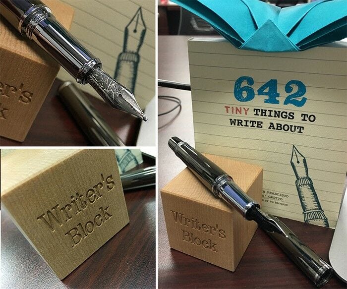 writers block wooden block and black ink pen desk decoration