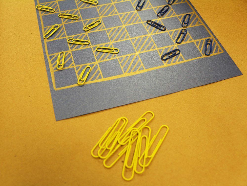 summer fun black and yellow diy paper clip checkerboard on yellow floor