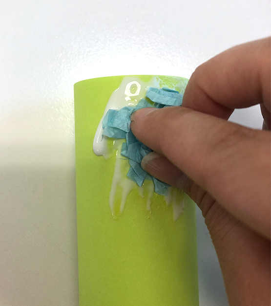 gluing tissue paper to paper towel roll