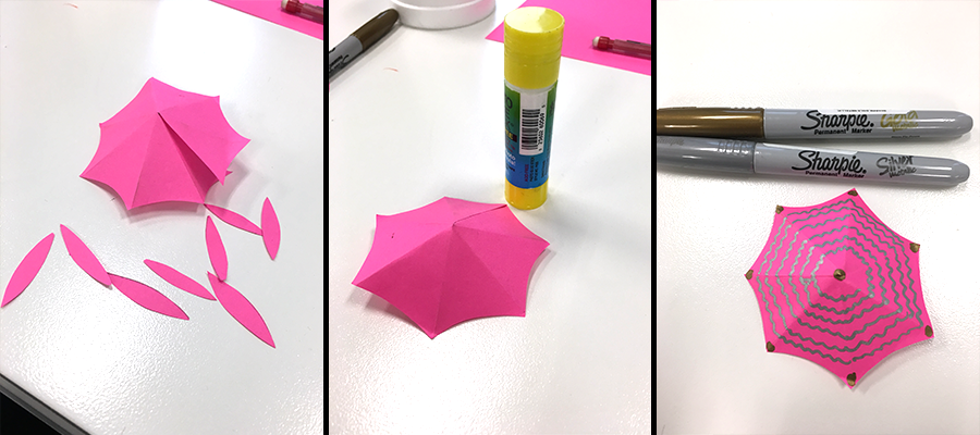 hot pink drink umbrella top decorated with markers