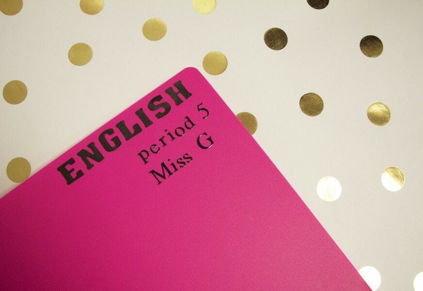 personalize school supplies: pink folder with black letter stickers