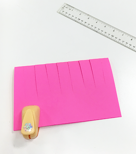 Pink paper clipped, ruler