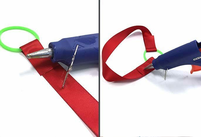 Hot glue gun used on red ribbon