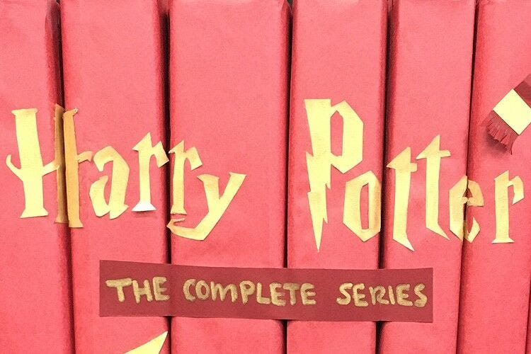 "harry potter" in gold translucent paper glued to books