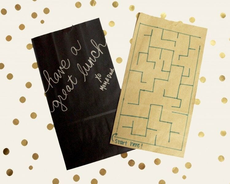 black and brown kraft paper bags personalized with sharpie decorations and maze
