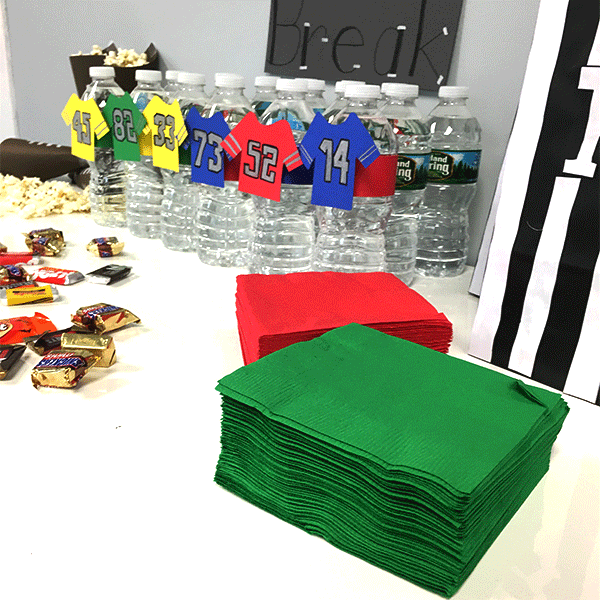 host a football party, paper, football, water bottles