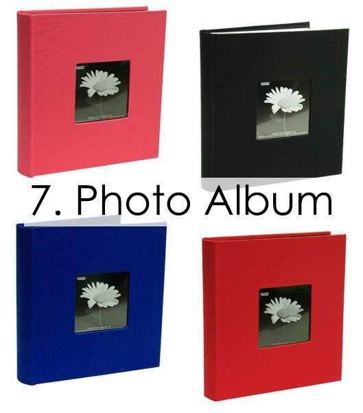 assortment of colorful hardcover photo albums books