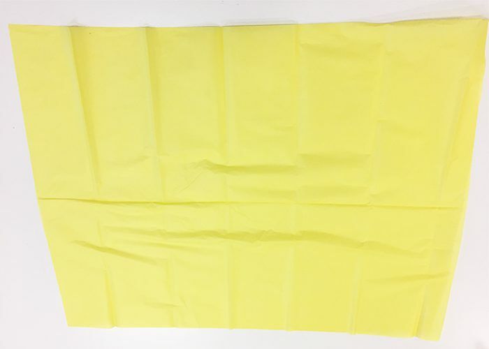 Flat yellow tissue paper