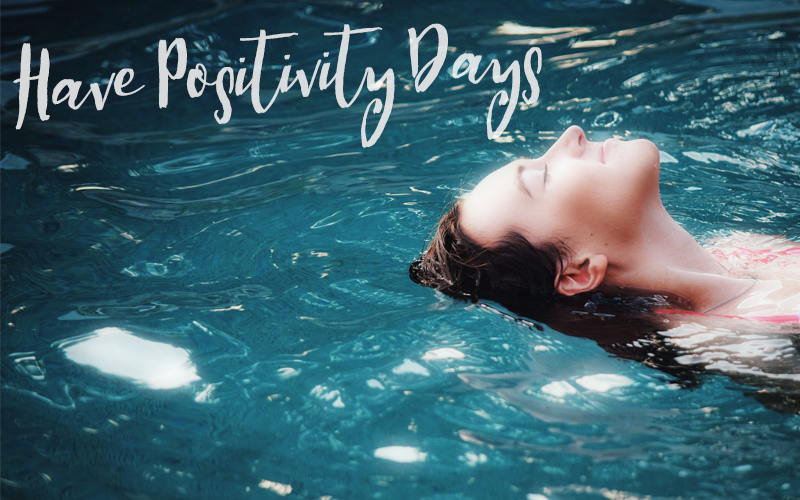 Caption "Have Positivity Days," with woman floating in water Woman relaxing floating in water, with text "Have Positivity Days"