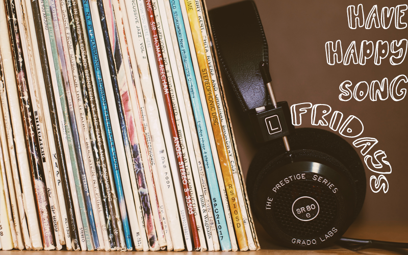 "Have Happy Song Fridays" - a pair of headphones and records stacked on a shelf Stack of records and a pair of headphones on a shelf with caption "Have Happy Song Fridays"