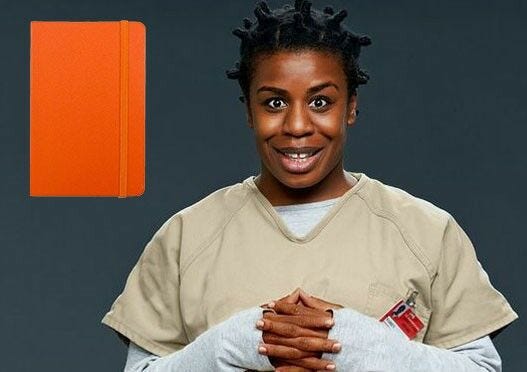 Suzanne 'Crazy Eyes' Warren orange notebook