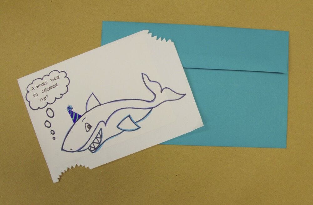 Blue envelope, shark card