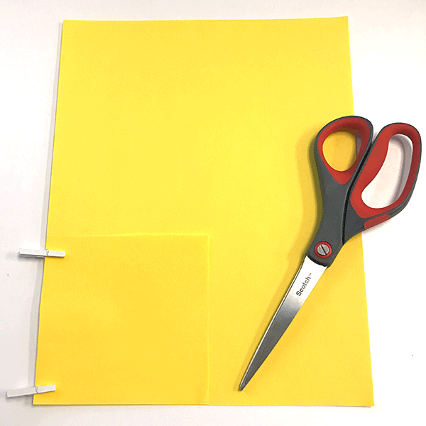 Scissors, yellow paper, wood clips