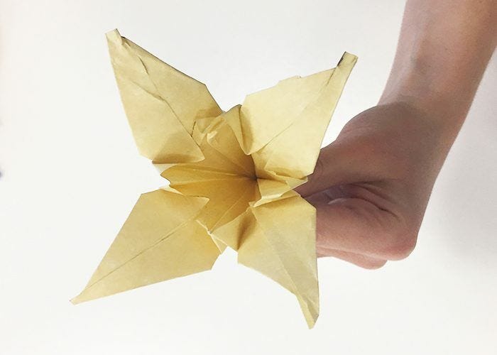 How To Make Paper Origami Easter Lilies, flower, lily, completed, holding, antique gold