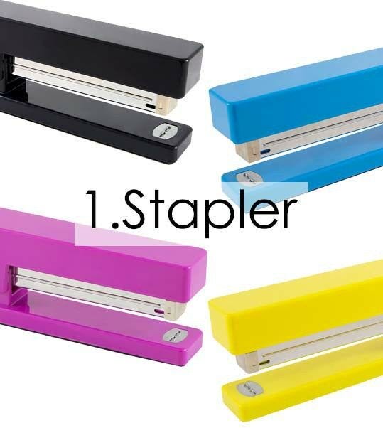 assorted colorful staplers in black pink blue and yellow