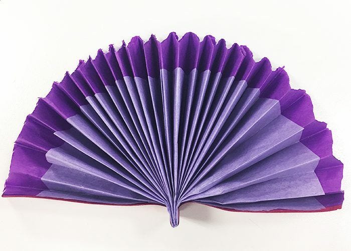 Finished white and purple fan Completed purple and white fan