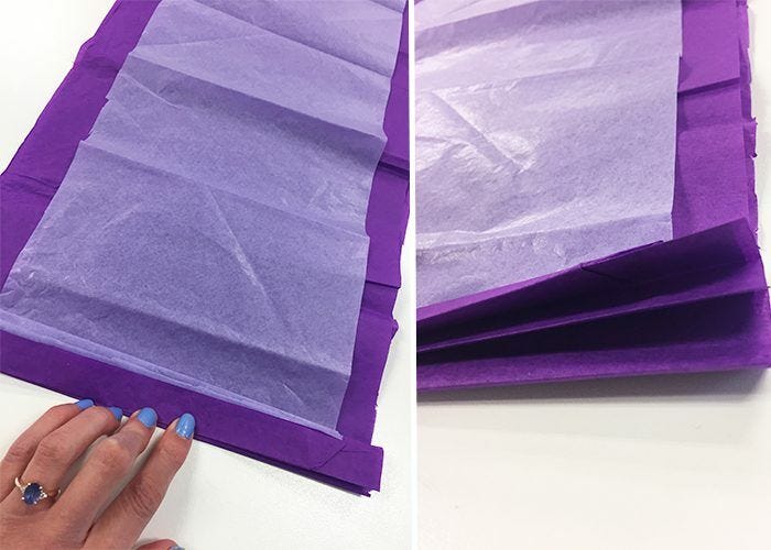 Accordion folds in purple and white tissue paper