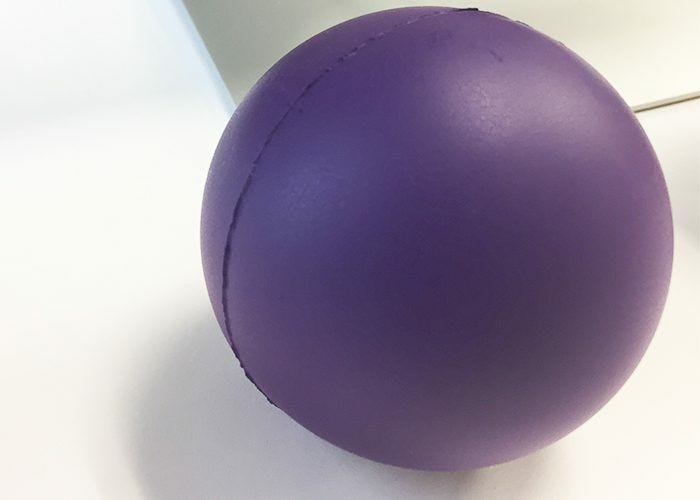 JAM's Official List of 10 Desk Essentials, Stress ball, purple, hands on, desk, office