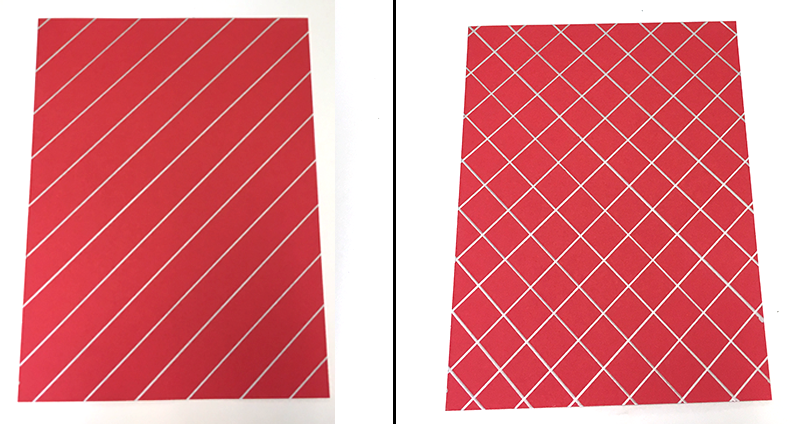 red paper with silver lines drawn in grid pattern