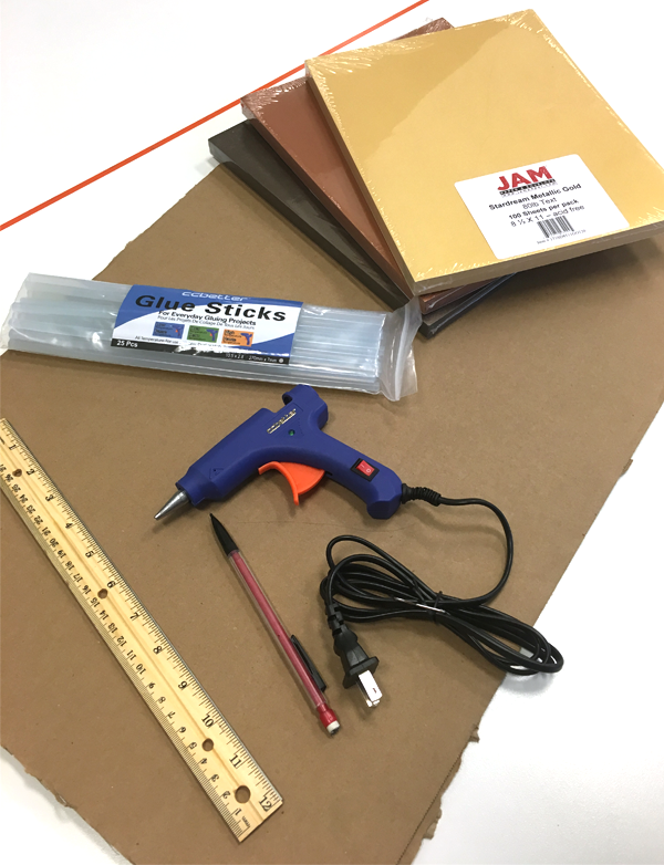 Glue gun, cardboard, glue sticks. black paper, brown paper, gold paper, pen, drill, ruler ruler, drill, pen, gold paper, brown paper, black paper, glue sticks, cardboard, glue gun