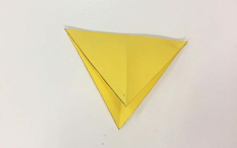 yellow paper folded in diamond