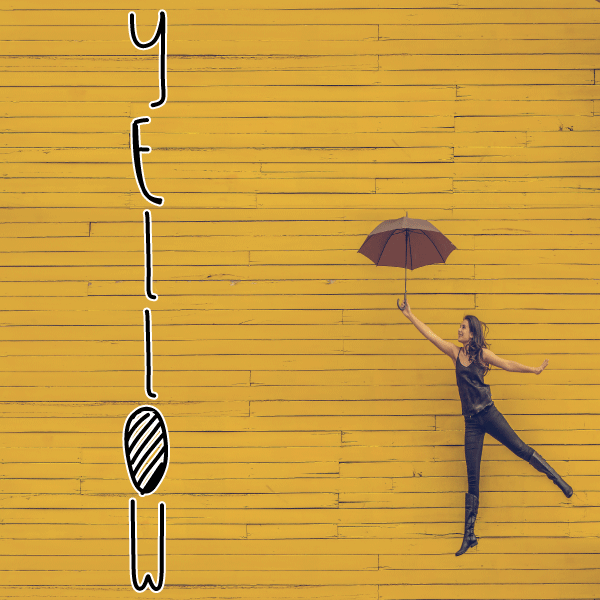 yellow wall, woman with umbrella